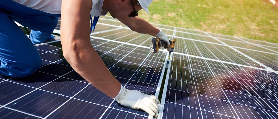 Man installing solar panels.